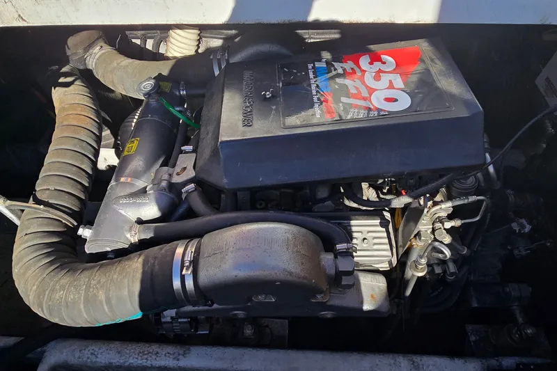 Slide: The Image of Engine of a 1995 Mainship 31 Sedan Bridge boat, featuring a 350 EFI motor. - 41