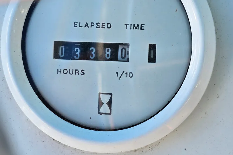 Slide: The Image of Hour meter showing 338 hours on 1995 Mainship 31 Sedan Bridge. - 16