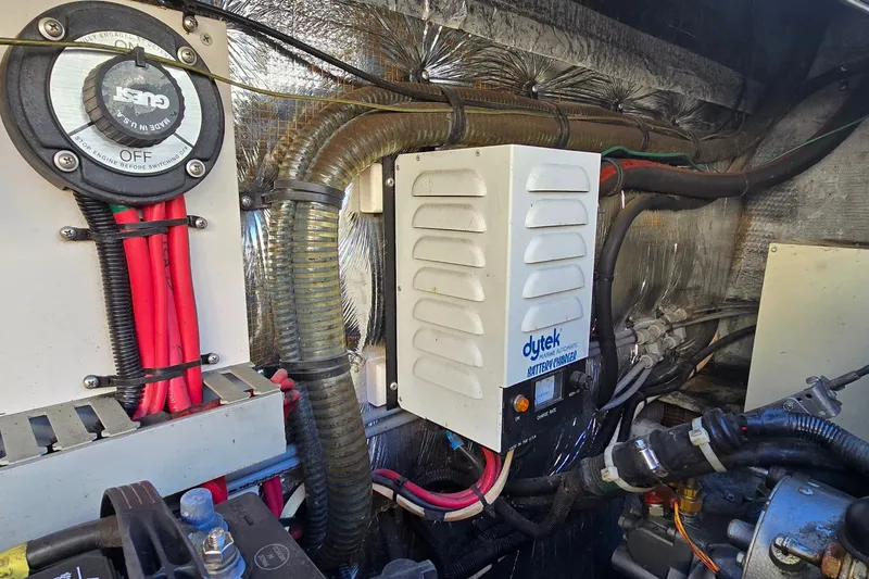 Slide: The Image of Engine room of 1995 Mainship 31 Sedan Bridge with Dytek battery charger and wiring. - 38