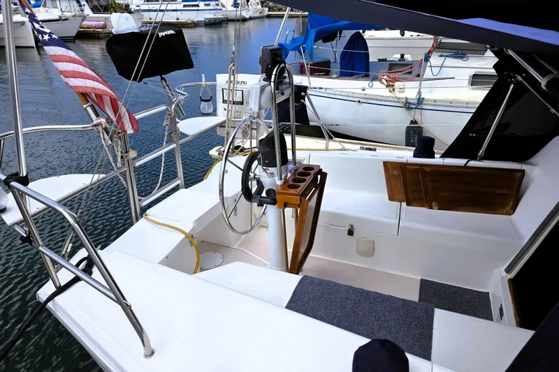 Slide: The Image of Cockpit of a 1995 Catalina 30 MkIII sailboat docked at a marina. - 1