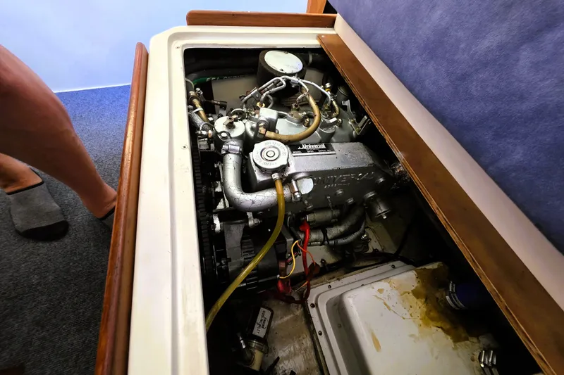 Slide: The Image of Engine compartment of a 1995 Catalina 30 MkIII sailboat, showcasing mechanical components. - 13