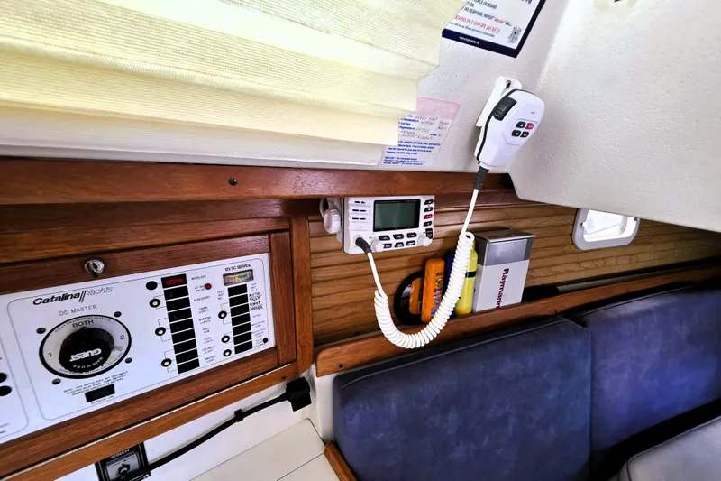 Slide: The Image of Interior of a 1995 Catalina 30 MkIII yacht showing control panels and communication equipment. - 15
