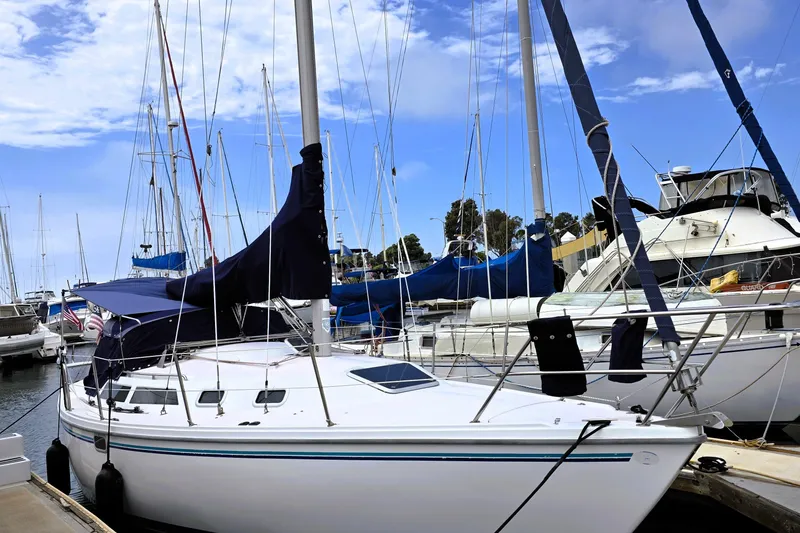 Slide: The Image of Sailboat Catalina 30 MkIII, 1995 model, docked at marina under blue sky. - 19