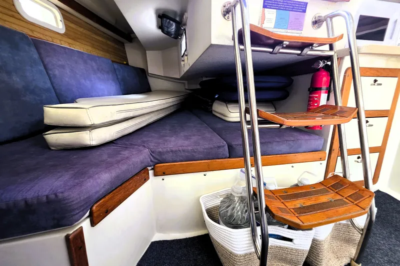 Slide: The Image of Interior of a 1995 Catalina 30 MkIII sailboat with seating, ladder, and storage. - 6