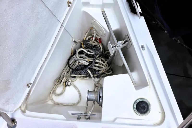 Slide: The Image of Anchor locker of a 1995 Catalina 30 MkIII sailboat with ropes and anchor. - 21
