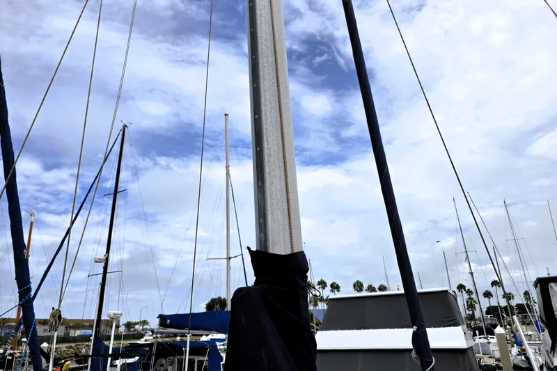 Slide: The Image of Sailboat mast of a 1995 Catalina 30 MkIII against a cloudy sky in a marina. - 22
