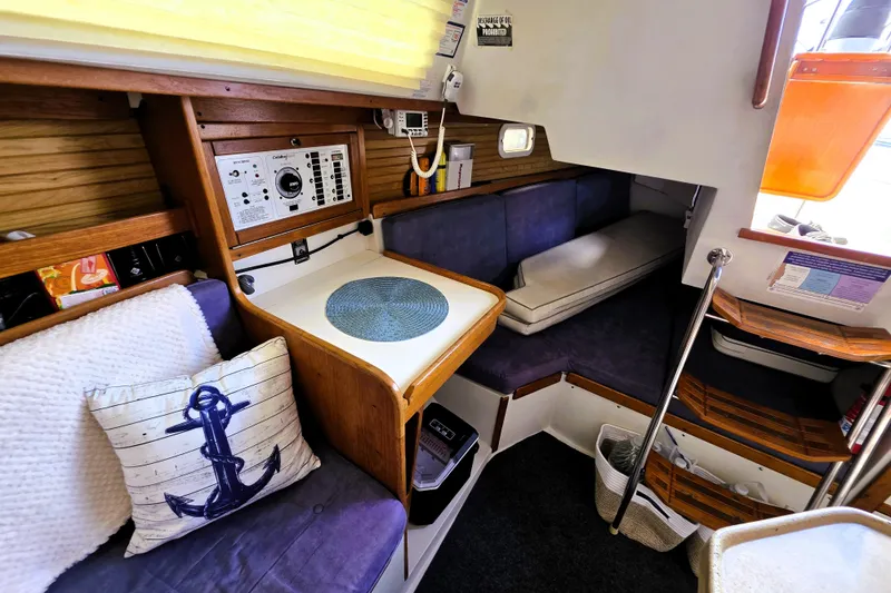 Slide: The Image of Interior of a 1995 Catalina 30 MkIII sailboat with cozy seating and nautical decor. - 7