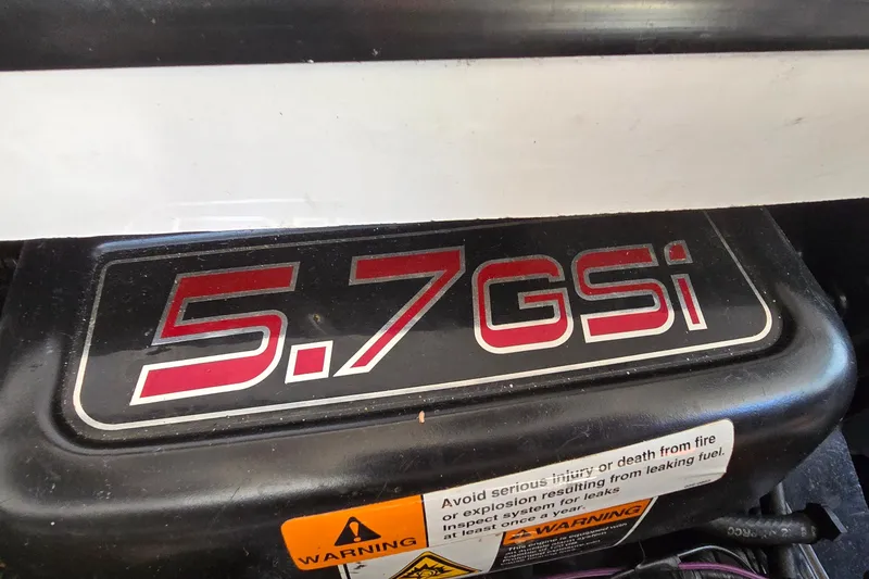 Slide: The Image of Engine cover of a 2000 Four Winns 328 Vista with 5.7 GSi label. - 35