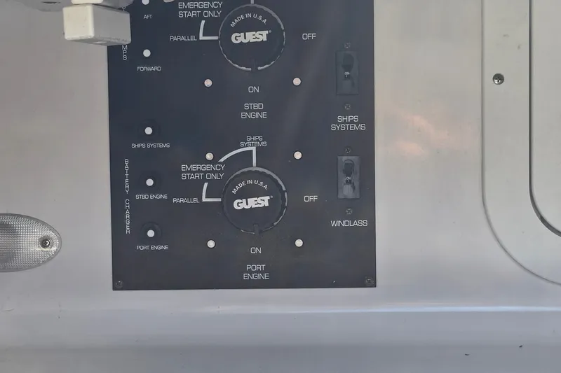 Slide: The Image of Control panel of a 2000 Four Winns 328 Vista boat, featuring engine and system switches. - 33