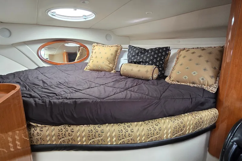 Slide: The Image of Luxurious cabin interior of 2000 Four Winns 328 Vista yacht with plush bedding. - 18