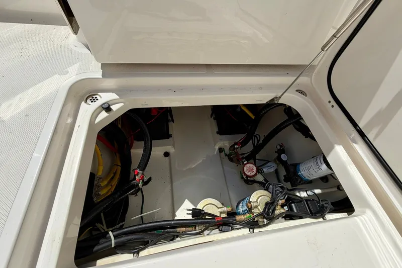 Slide: The Image of 2022 Pursuit DC 266 Dual Console engine compartment with wiring and components visible. - 17