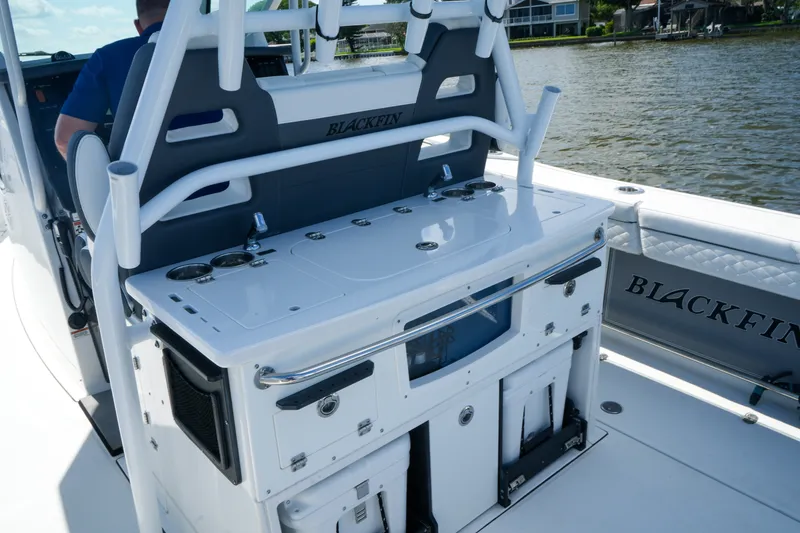 Slide: The Image of 2023 Blackfin 332 CC boat interior with fishing station and storage compartments. - 30