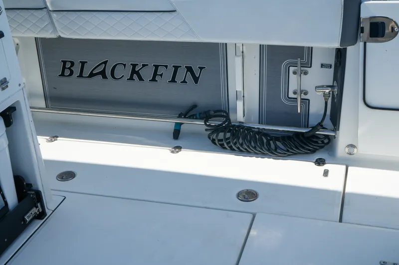 Slide: The Image of 2023 Blackfin 332 CC boat interior with logo and coiled cable. - 28