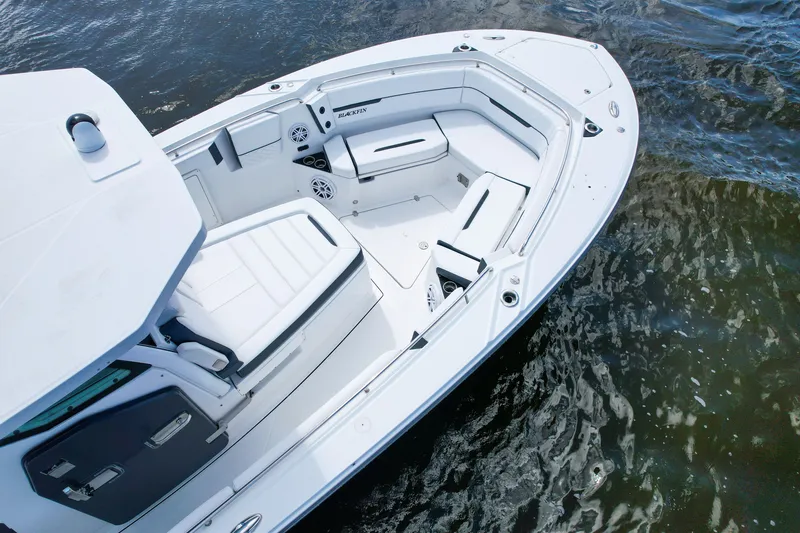 Slide: The Image of 2023 Blackfin 332 CC boat with spacious seating on calm water. - 22