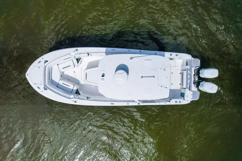 Slide: The Image of Aerial view of 2023 Blackfin 332 CC boat on water. - 3