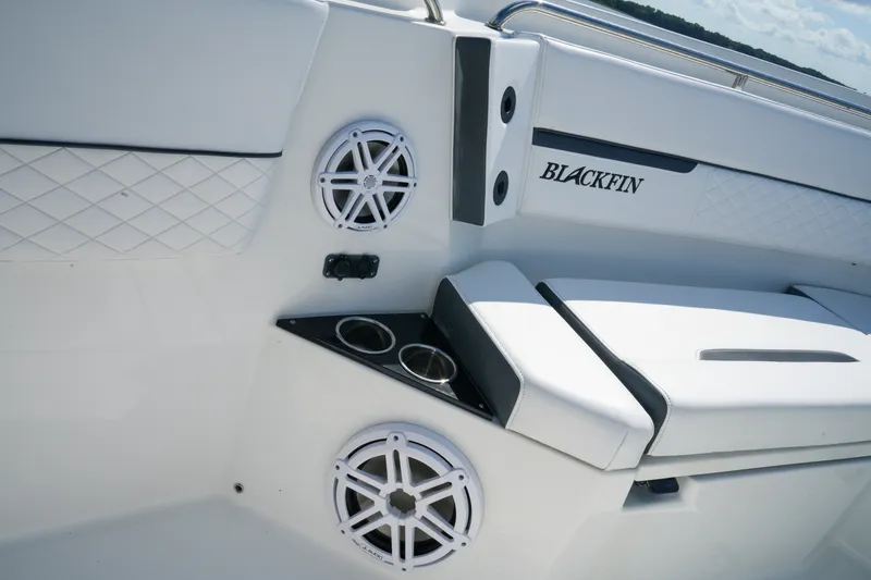 Slide: The Image of 2023 Blackfin 332 CC boat interior with speakers and cup holders. - 35