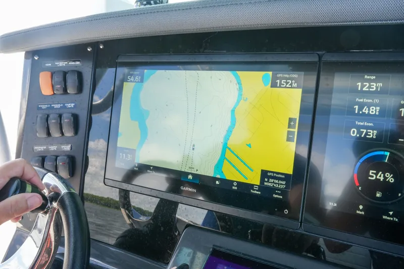 Slide: The Image of Dashboard of 2023 Blackfin 332 CC boat with Garmin navigation display. - 19