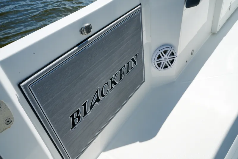 Slide: The Image of 2023 Blackfin 332 CC boat interior with logo and speaker detail. - 31