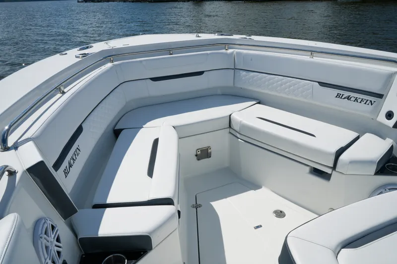 Slide: The Image of 2023 Blackfin 332 CC boat interior with luxurious white seating and sleek design. - 34