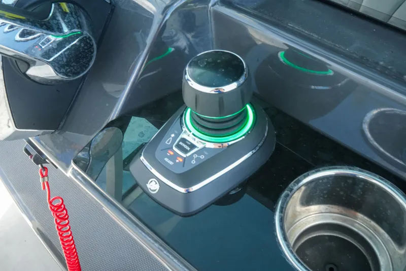 Slide: The Image of Control panel of 2023 Blackfin 332 CC boat with joystick and cup holder. - 42