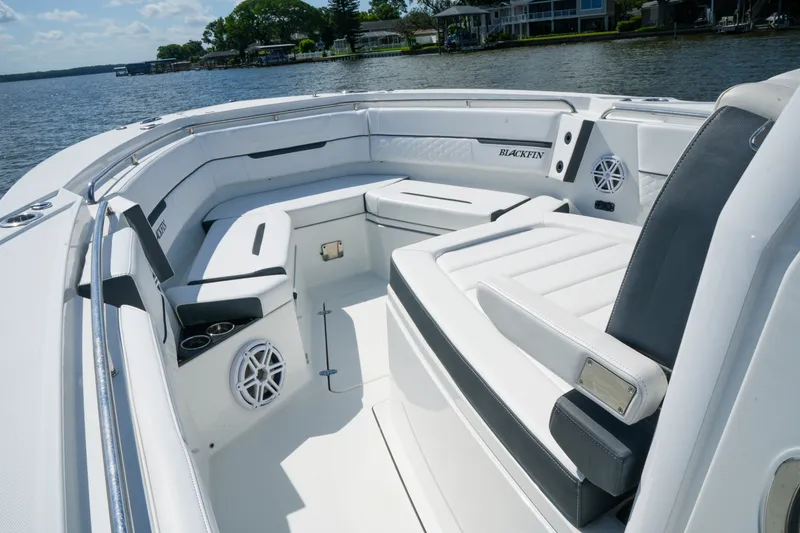 Slide: The Image of 2023 Blackfin 332 CC boat interior with luxurious seating and modern design on a sunny day. - 13