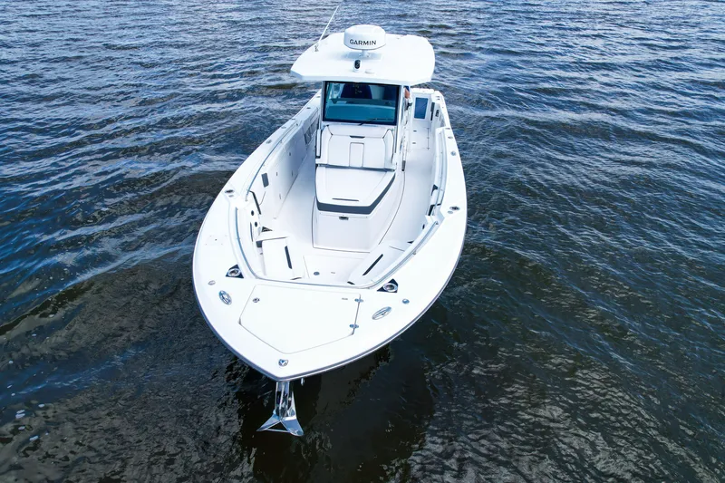 Slide: The Image of 2023 Blackfin 332 CC boat on open water, showcasing sleek design and advanced features. - 24