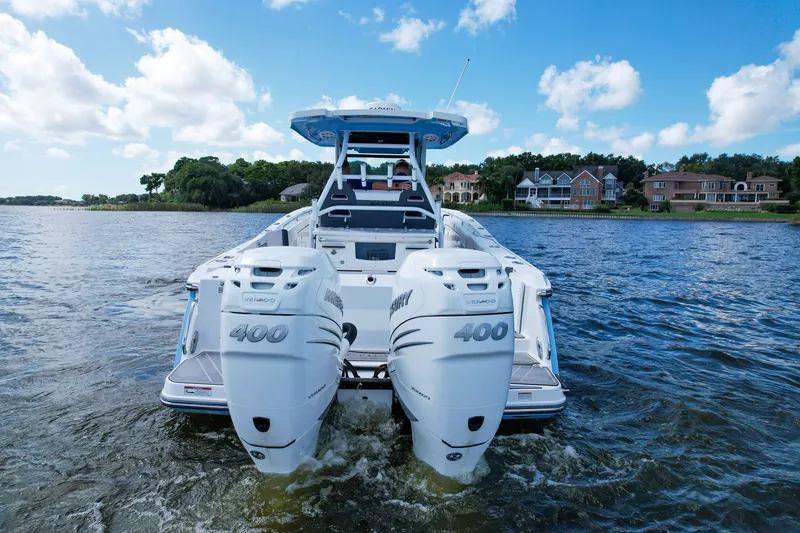 Slide: The Image of 2023 Blackfin 332 CC boat with twin Mercury 400 engines on a scenic lake. - 21