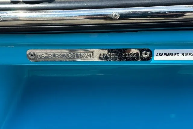 Slide: The Image of Close-up of a boat hull with serial number and country of origin. The hull is blue. - 22