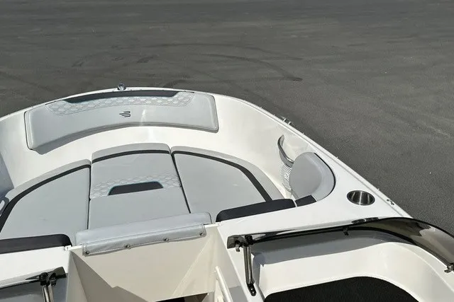 Slide: The Image of The image shows the bow of a 2024 Bayliner M17 boat with gray cushions. - 16