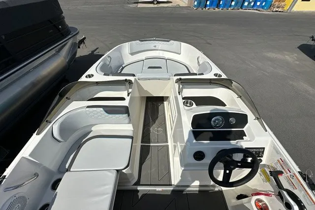 Slide: The Image of The image shows the cockpit of a 2024 Bayliner M17 with modern seating and controls. - 12