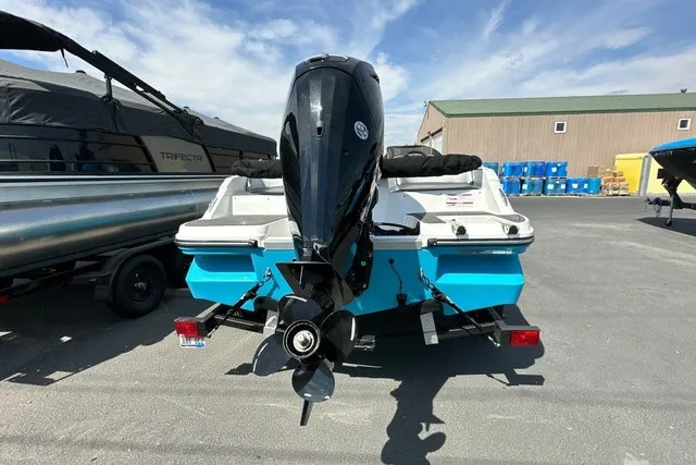 Slide: The Image of The image shows a 2024 Bayliner M17 boat with an outboard motor on a trailer. - 3