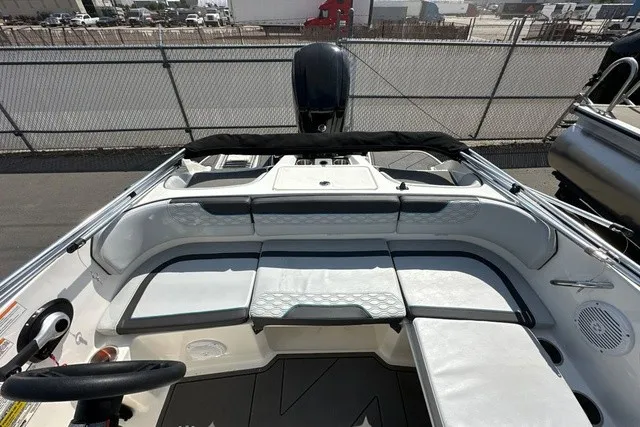 Slide: The Image of The image shows the cockpit of a 2024 Bayliner M17 with cushioned seating. - 10