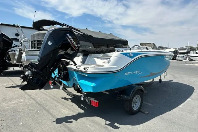 Slide: The Image of A blue and white 2024 Bayliner M17 on a trailer. The outboard motor is visible. - 19
