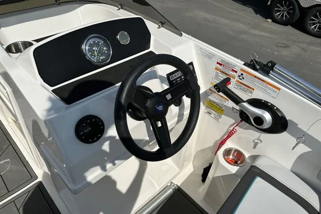 Slide: The Image of The image shows the helm of a 2024 Bayliner M17 with a modern dashboard. - 18