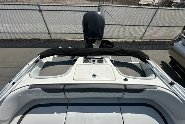 Slide: The Image of The image shows the stern of a 2024 Bayliner M17 boat with an outboard motor. - 11