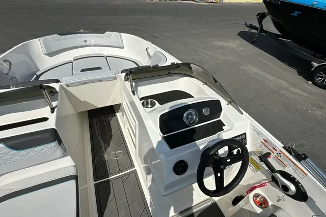 Slide: The Image of The image shows the cockpit of a 2024 Bayliner M17 with a modern helm station. - 15