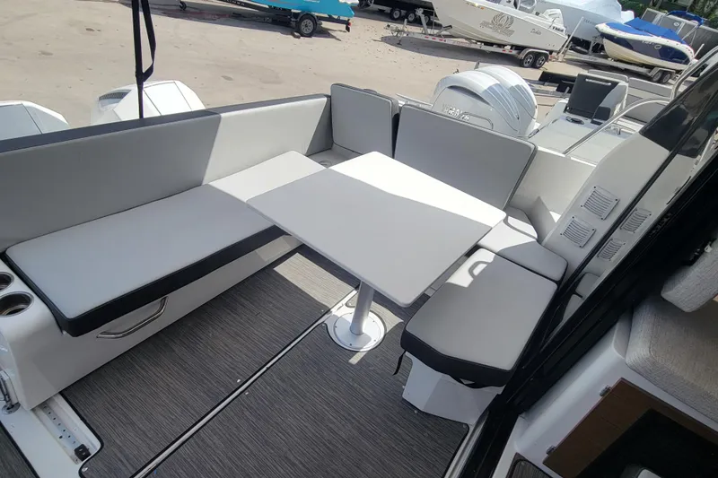 Slide: The Image of 2023 Jeanneau NC 895 boat interior with seating and table in a modern design. - 8