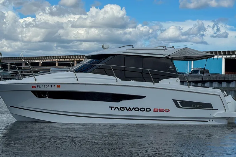 The Image of 2023 Jeanneau NC 895 boat on water, featuring sleek design and modern amenities. - 0