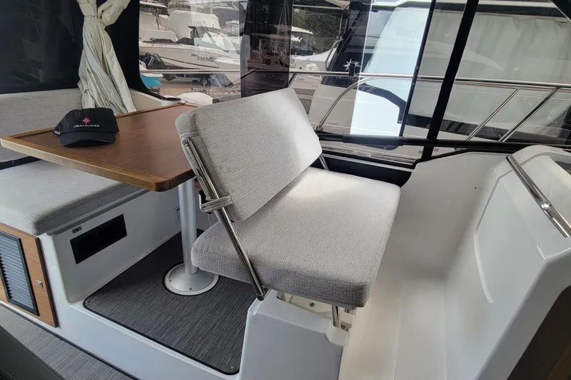 Slide: The Image of Interior of 2023 Jeanneau NC 895 boat with seating and table. - 12