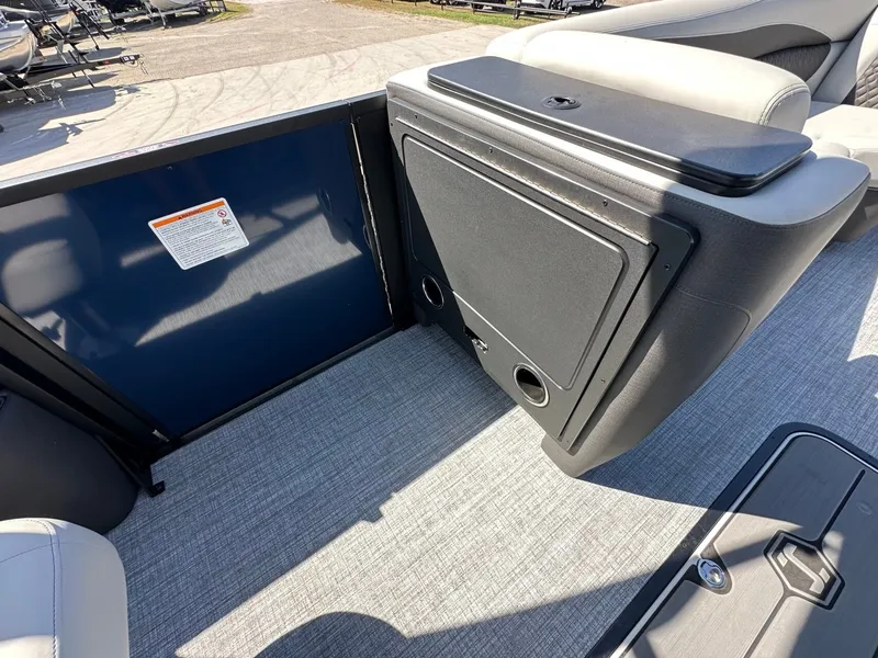 Slide: The Image of The image shows the interior of a 2027 Harris Sunliner 230 with gray carpeting. - 34