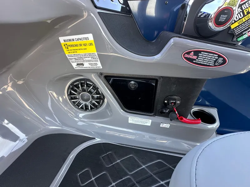 Slide: The Image of Close-up of a Harris Sunliner 230 console with speaker and warning labels. - 35