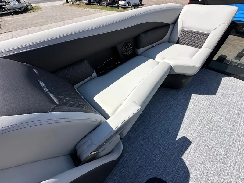 Slide: The Image of The image shows the luxurious, cushioned seating area of a 2027 Harris Sunliner 230. - 24