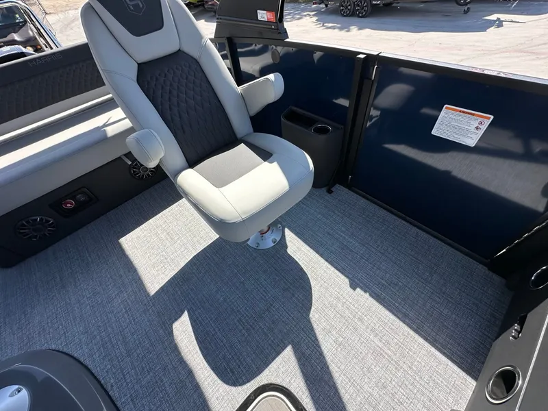 Slide: The Image of The 2027 Harris Sunliner 230 features a sleek chair on a gray carpeted floor. - 33