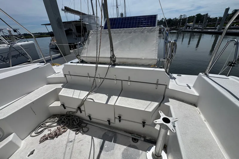 Slide: The Image of Cockpit of 2007 Gemini 105 MC catamaran with ropes and solar panel, docked at marina. - 10