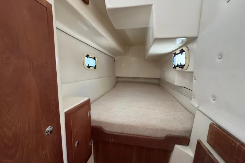 Slide: The Image of Interior cabin of 2007 Gemini 105 MC sailboat with cozy sleeping area. - 16