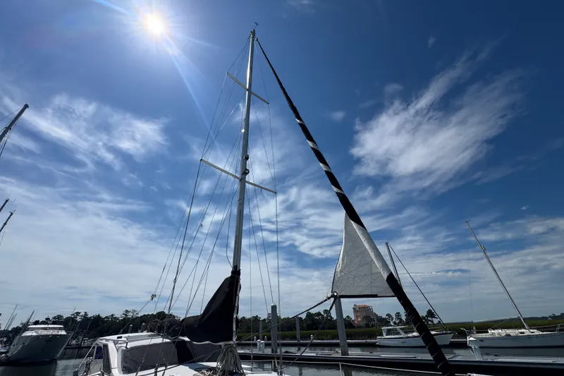 Slide: The Image of Sailboat Gemini 105 MC 2007 under sunny sky at marina. - 6