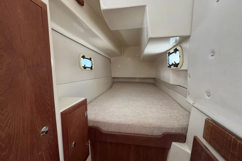 Slide: The Image of Interior cabin of 2007 Gemini 105 MC sailboat, featuring cozy sleeping quarters. - 17