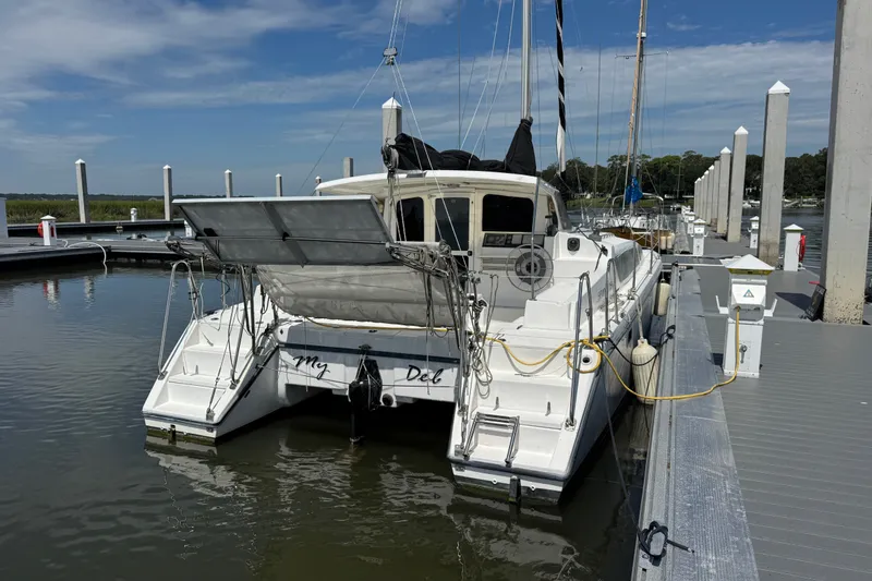 Slide: The Image of 2007 Gemini 105 MC catamaran docked at marina under clear blue sky. - 7