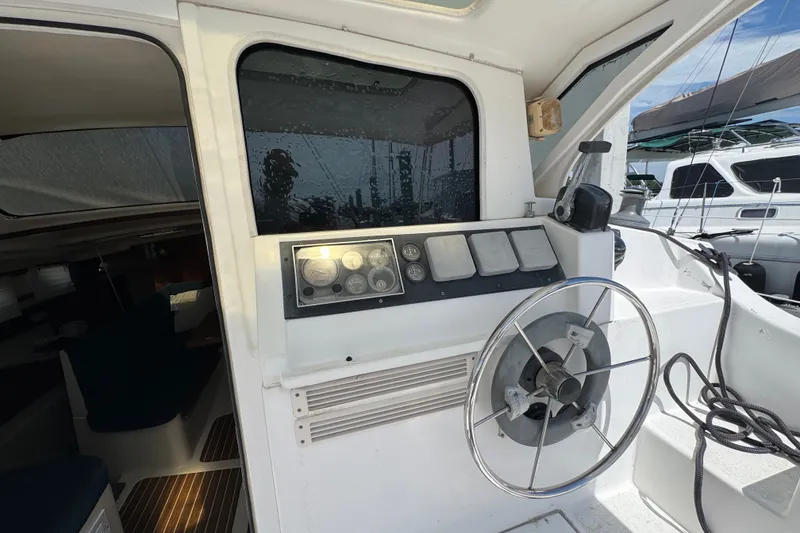 Slide: The Image of Steering wheel and control panel of a 2007 Gemini 105 MC catamaran. - 11