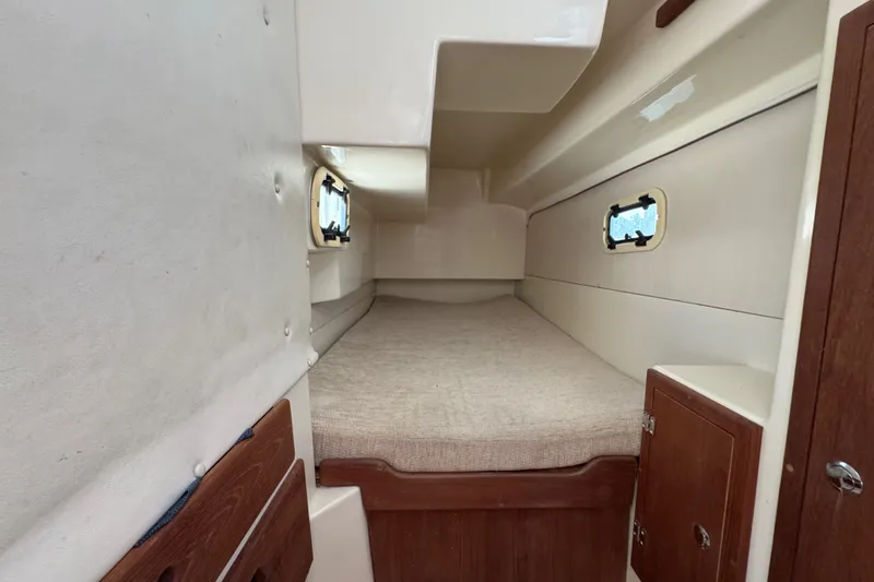 Slide: The Image of Interior cabin of a 2007 Gemini 105 MC sailboat with cozy sleeping area. - 22
